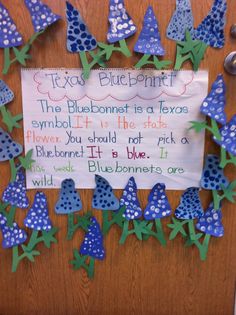 a bulletin board with bluebells on it and a sign that says, the bluebonnet is a texas