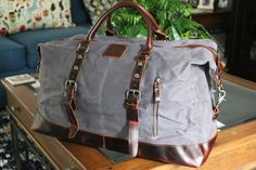 This Waxed Canvas is a true Western Classic Duffle an Oversized Travel Bag, Carry-On Bag, Luggage Bag, Canvas Travel Bag, Overnighter, quick Holiday Bag, you name it it can do it.. This Classic Western will not disappoint as a Unique Gift that shows a Bold statement for that special person. Description: -Full-grain leather and Waxed Canvas -Length: 54cm(21.6'') Height: 42cm(16.5'') Depth: 23cm(9'') -Inside two zipper pockets, two open pockets, one main compartment, zipper closure top, long adjus Waxed Canvas Duffle Bag, Canvas Weekender Bag, Canvas Duffle Bag, Canvas Travel Bag, Unique Gifts For Him, Holiday Bag, Bags Aesthetic, Travel Duffel, Duffel Bag Travel