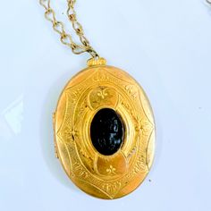 Antique Large Gold Black Onyx Cameo Pendant Necklace, Victorian Renaissance Gothic Large Victorian Gold Mourning Locket, Black Onyx Cameo And Heavy Gold Intricate Chain. Circa 1900s This Is A Gorgeous Black Glass Cameo Set In A Very Ornate Gold / Brass Finish Metal Frame With Elaborate Designs On The Inside Of Locket As Well. The Cameo Is Very 3-Dimensional. This Is Quite A Statement Piece! It Comes On A Gold Tone 24 Inch Chain With A Clasp. The Cameo Is In Excellent Condition. No Chips Or Scratching. The Chain Is In Excellent Condition. Cameo Pendant Necklace, Victorian Gold, Cameo Pendant, Gold Brass, Art References, Black Glass, Brass Finish, Black Onyx, Gold Black