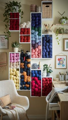 there are many different colored balls of yarn on the shelves in this crafting room