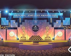 the national jewelry awards logo is shown in front of a stage with lights on it