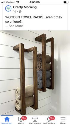 a wooden towel rack in the corner of a bathroom with towels on it and an ad for wood towel racks