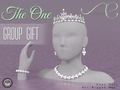 a white mannequin head wearing a tiara and pearls with the words, the one group gift