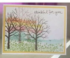 a card with some trees on it and the words thank you written in cursive writing