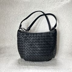 Super Cute Dot Crossbody Bag From Bottega Veneta Featuring Brand Signature Intriciato Pattern Luxe Calf Leather With Intriciato Pattern Classic Black Color Vintage Black Hardwares Bottom Side Gathering Details Top Zip Closure Inside Fabric Lining Fully Lined Single Leather Strap, Detachable Measurements Approximately 8.5in L X 7in H X 4in D Intrecciato Weave Crossbody Bag For Office, Office Intrecciato Weave Crossbody Bag, Formal Satchel Bag With Intrecciato Weave, Evening Pouch Shoulder Bag With Intrecciato Weave, Black Leather Shoulder Bag With Intrecciato Weave, Office Shoulder Bag With Intrecciato Weave, Elegant Woven Leather Hobo Bag For Daily Use, Black Leather Intrecciato Shoulder Bag, Black Leather Intrecciato Weave Shoulder Bag