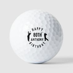 a white golf ball with the words happy 80th birthday printed on it's side