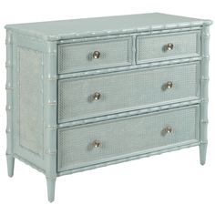 a white dresser with three drawers and silver knobs