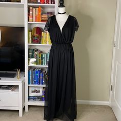 Beautiful Chiffon Style Deep V Jumpsuit With Tie Back And Split Sleeves. Unworn. Elastic Waist And Completely Lined. Length Is Approx. 60” From Shoulder. Bundle And Save Open To Offers Low Ball Offers Trades Chic Flowy Jumpsuits And Rompers For Party, Chic Flowy Jumpsuits For Party, Black Chiffon Maxi Dress For Night Out, Black Maxi Length Jumpsuits And Rompers For Party, Black Maxi Length Jumpsuits For Party, Black Party Jumpsuits And Rompers, Black Maxi Length Jumpsuits And Rompers For Evening, Summer Formal Chiffon Jumpsuits And Rompers, Elegant Sheer Jumpsuits And Rompers For Summer