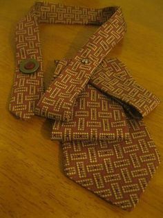 three ties laid out on a wooden table