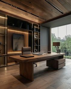 a large wooden desk sitting in the middle of a living room next to a window