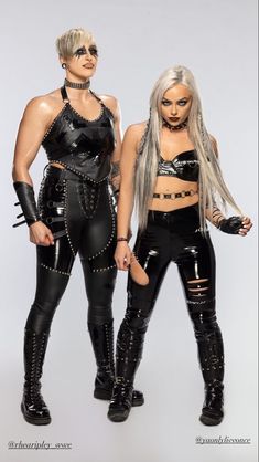 two women in leather outfits posing for a magazine cover with the words, wrestling manias looks