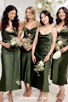 bridesmaids in green dresses posing for the camera