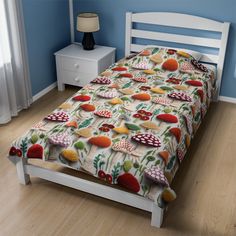 a bed in a bedroom with blue walls and wooden flooring that has mushrooms on it