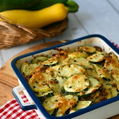 a casserole dish with zucchini and cheese