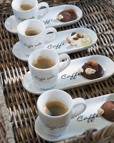 coffee cups filled with different types of pastries