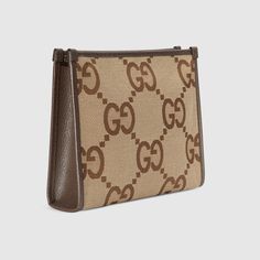 Shop the Jumbo GG pouch in beige at GUCCI.COM. Enjoy Free Shipping and Complimentary Gift Wrapping. Gucci Pouch, Bags Gucci, Italy Print, Brand Logos, Key Pouch, Digital Gifts, Recycled Leather, Coin Pouch, Beauty Items