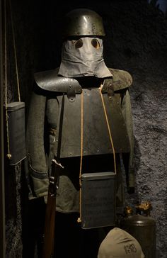 a helmet and armor are on display in a museum