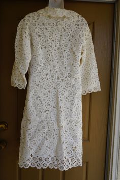 "Vintage 1970s crocheted jacket with full lining. No tags - estimated size M. In great vintage condition. Measurements taken across front laid flat 20\" armpit to armpit 19\" across waist 40\" length" White Vintage Crochet Dress For Spring, Fitted White Crochet Outerwear, White Fitted Vintage Crochet Dress, Cream Crochet Dress With Long Sleeves, Cream Long Sleeve Fitted Crochet Dress, Cream Fitted Long Sleeve Crochet Dress, Crocheted Jacket, Studio 54 Party, 70s Jacket