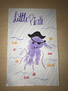 a child's drawing of a purple octopus wearing a hat and holding a starfish