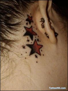 a woman's behind the ear with stars on it