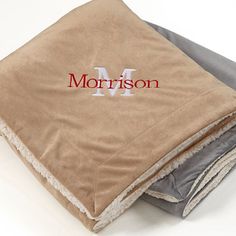 a pile of folded towels with the word'm'on it and an advertise