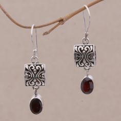 From Sukartini of Bali comes this exquisite pair of handcrafted dangle earrings. Brilliant garnets with a total weight of 2.5 carats dangle beneath sterling silver pendants engraved with swirl designs, creating a look that is both elegant and exotic. materials: 925 sterling silver, garnets Hook earrings Combination finish Natural stone - some variations in color and/or pattern are to be expected 1.6 in. L x 0.4 in. W x 0.2 in. D Beaded Jewelry Earrings, Beaded Earrings Diy, Beaded Earrings Patterns, Handmade Wire Jewelry, Beaded Hoop Earrings, Handcrafted Earrings, Earring Patterns, Silver Pendants, Precious Jewelry