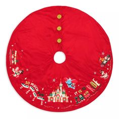 a red christmas tree skirt with disney characters on it