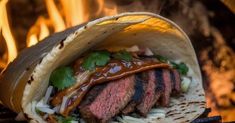 a steak taco sitting on top of a grill