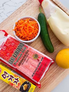 carrots, celery, and other ingredients are laid out on a cutting board