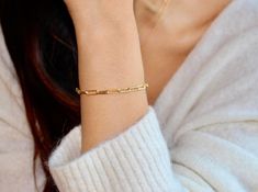 This gorgeous Paperclip Chain Bracelet is made from 18k gold vermeil and gives the look of simplicity, stylish and bold all at the same time. The Paperclip Chain Bracelet looks great on its own or when stacked. Details: The Paperclip Chain Bracelet is available from 5 - 9 inches and comes with a 1 inch adjustable extender chain. Each link measures 4mm in width and 10mm in length. Gold Vermeil SHIPPING & PACKAGINGAll items come packaged in a small jewelry box which is perfect for when buying Hand Bracelet, Estilo Hip Hop, Simple Bracelets, Minimalist Bracelet, Trombone, Dainty Bracelets, Gold Bracelet Chain, Diy Pendant, Everyday Jewelry