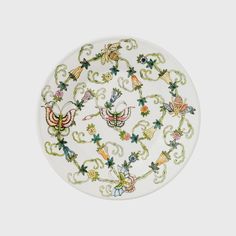 a white plate with colorful designs on it