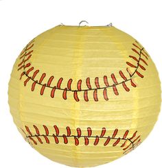 a yellow paper lantern with red stitching on the outside and baseballs on the inside