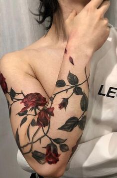 a woman's arm with flowers on it