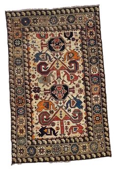 an old rug with many different designs on it