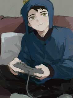 a person sitting on a couch holding a game controller