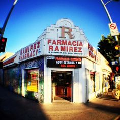 an image of a store that is on the side of the road in front of a traffic light