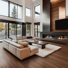 a modern living room with wood floors and large windows