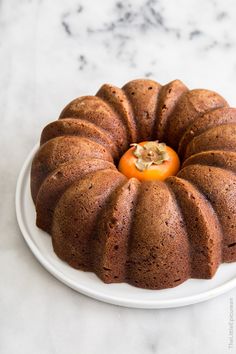 a bundt cake with an orange on top