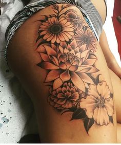 a woman's thigh with flowers on it