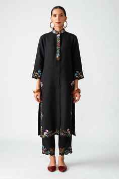 Black kurta with floral embroidered motifs, side slits and oversized placket. Paired with cropped scallop hem pant.
Component: 2
Pattern: Embroidered
Type Of Work: Floral motifs, Thread work
Neckline: Mandarin collar
Sleeve Type: Three-quarter sleeves
Fabric: Linen
Color: Black
Other Details: 
Side slits
Scallop hem pant
Oversized placket
Embroidered motifs
Occasion: Party - Aza Fashions Payal Pratap, Suits Design, Embroidery Suits Design, How To Hem Pants, Indian Fashion Designers, Kurta With Pants, Clothing Websites, Embroidery Suits, Desi Fashion