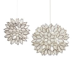 Handcrafted by artisans in the Philippines, our dramatic pendant shade features white capiz seashells formed into a flower sphere in your choice of sizes. The naturally harvested shells glow with a warm radiance when illuminated, creating a soothing ambience. Pair this luminous hanging lamp with one of our electrical ceiling kits to create a custom hanging lamp that's ready to light up a room. Affordable Pendant Lighting, Zigzag Design, Light Guide, Lotus Pendant, Shine The Light, Pendant Shade, Capiz Shell, Cost Plus World Market, Bath Light