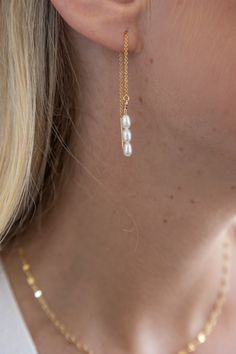 These pearl threaders are a dainty statement earring - effortlessly draping to accentuate the beauty in every wearer. We love a threader for an understated elegance incorporated into your weekly routine. 4" total length Genuine Freshwater Pearls Gold Filled Threaders Nickel Free Hypoallergenic Designed and handmade at Adorn's storefront in Steamboat Springs, CO Care: Avoid salt water, chlorine and harsh chemicals. Polish regularly with a jewelry cloth to improve shine. Be mindful that perfume, l Pearl Threader Earrings, Batik Pillow, Cake Stand Ceramic, Weekly Routine, Steamboat Springs, Statement Earring, Threader Earrings, Understated Elegance, Olive Wood