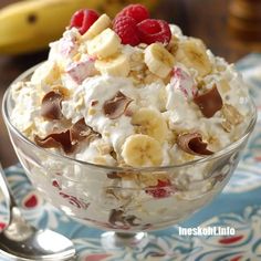 a bowl filled with cereal and fruit on top of a table