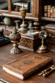 an antique desk with books and other items on it