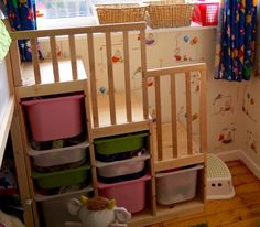 a child's room with toys and storage containers