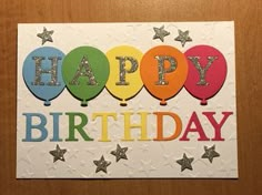 a happy birthday card with balloons and stars