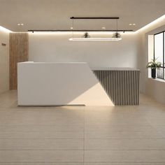 an empty white reception room with large windows and planters on the wall above it