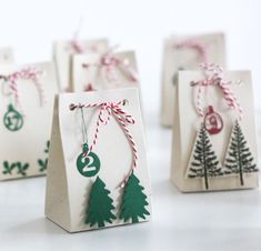 several small bags with christmas decorations on them