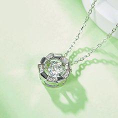 An eye-catching round moissanite dances with ease at the center of this appealing women's necklace, expressing your unstoppable love. Additional round gem set in sterling silver frame the center. Features Moissanite was originally found in meteorites(Chemical name: Silicon Carbide). It was first discovered in 1893, while a scientist was examining meteor samples from a crater in Arizona. After many years, the experts has been recreated moissanite in the laboratory, that make the gemstone with fri Women's Necklace, Silicon Carbide, Moissanite Necklace, Moissanite Jewelry, Round Moissanite, Timeless Jewelry, Stone Cuts, Silver Frame, Stone Necklace