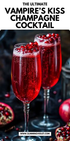 two glasses filled with champagne and pomegranate on top of a black table